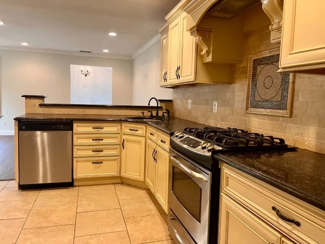 a kitchen with a stove and a microwave