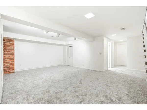 a view of an empty room with a balcony