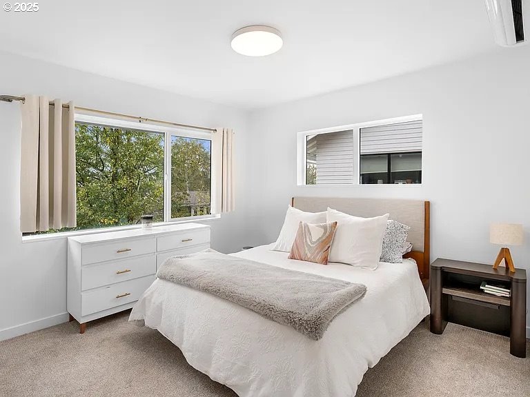 3590 Southwest Patton Road, Unit C Portland, OR 97221 - Photo 16 of 40 a bedroom with a bed and a window