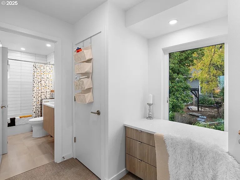 3590 Southwest Patton Road, Unit C Portland, OR 97221 - Photo 19 of 40 a bathroom with a sink and a mirror