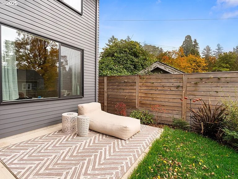 3590 Southwest Patton Road, Unit C Portland, OR 97221 - Photo 21 of 40 a view of a chair and table in backyard of the house