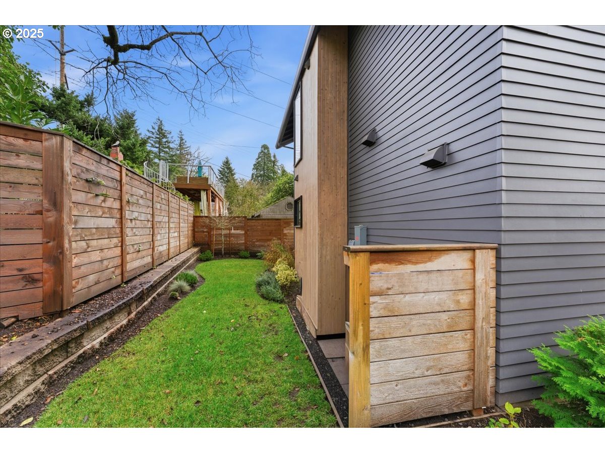 3590 Southwest Patton Road, Unit C Portland, OR 97221 - Photo 26 of 40 a view of a house with a backyard