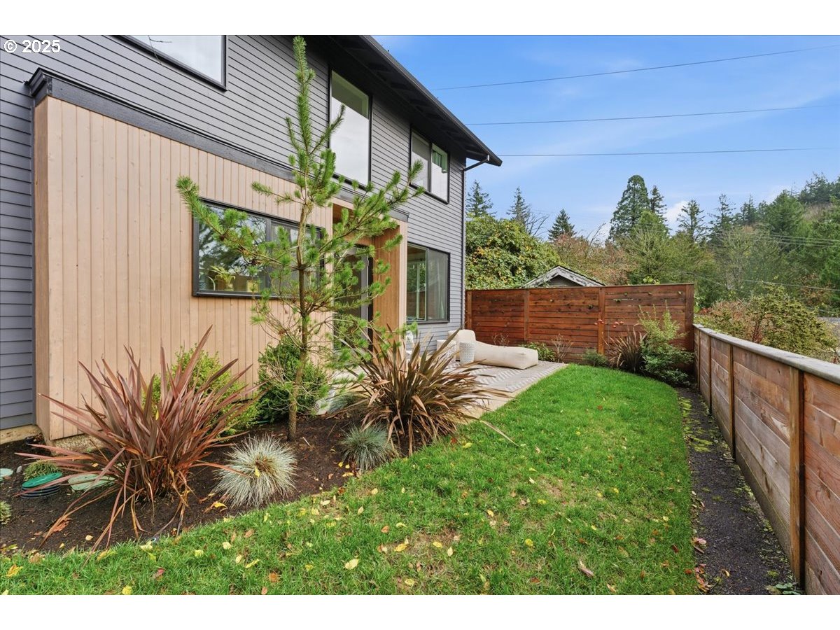 3590 Southwest Patton Road, Unit C Portland, OR 97221 - Photo 28 of 40 a front view of a house with a yard