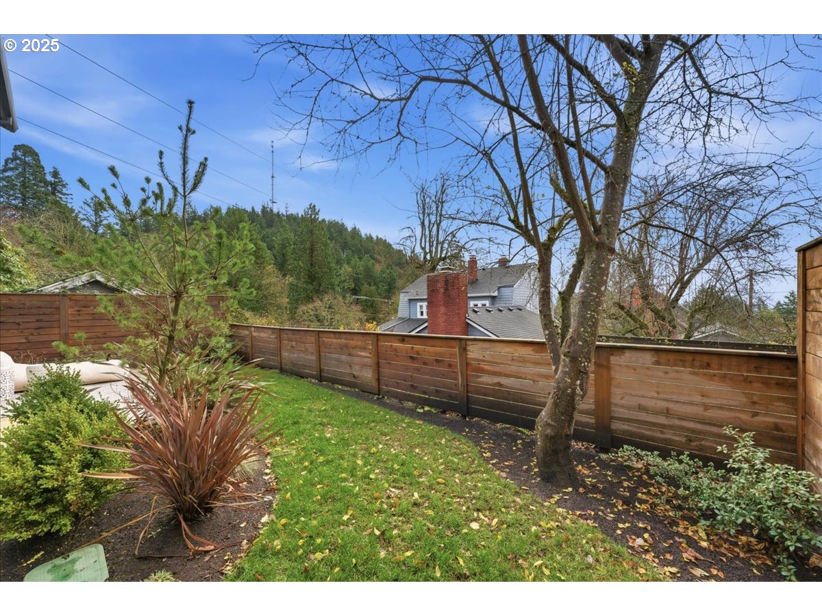 3590 Southwest Patton Road, Unit C Portland, OR 97221 - Photo 29 of 40 a view of a yard with an outdoor space
