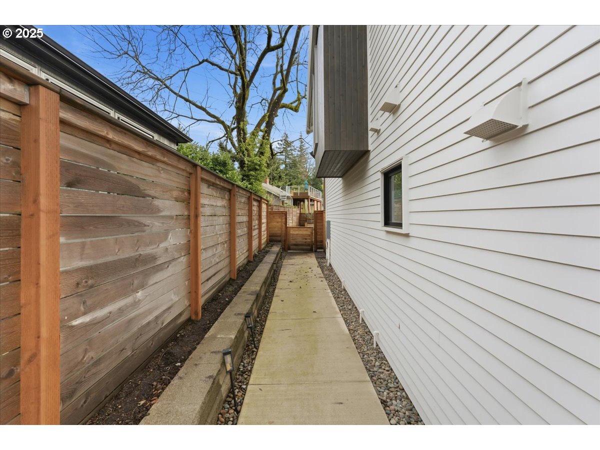 3590 Southwest Patton Road, Unit C Portland, OR 97221 - Photo 3 of 40 a view of a house with a large window