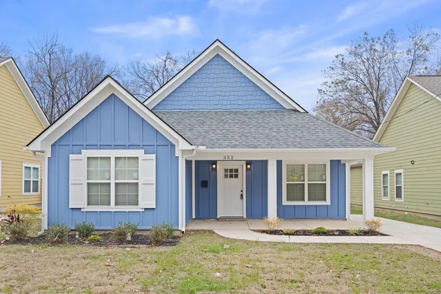 a front view of a house with a yard