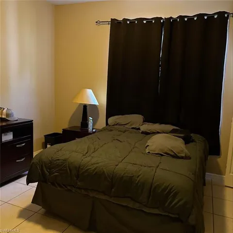 a bedroom with a bed and a closet