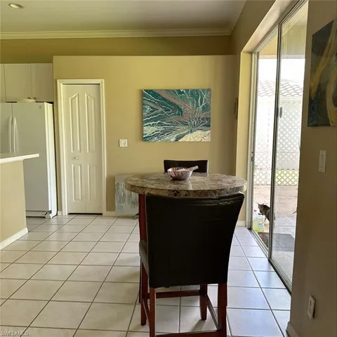 a room with a table and chairs