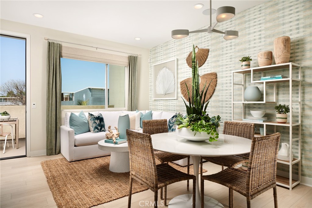 4882 Long Beach Boulevard Long Beach, CA 90805 - Photo 2 of 6 a view of a dining room with furniture and wooden floor