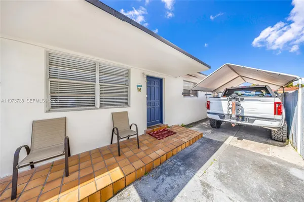 a view of an entryway with a backyard