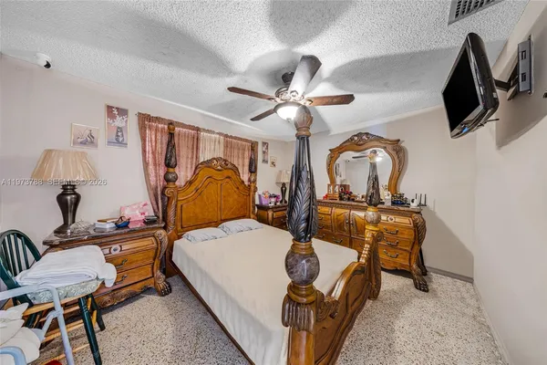 a bedroom with furniture and a window