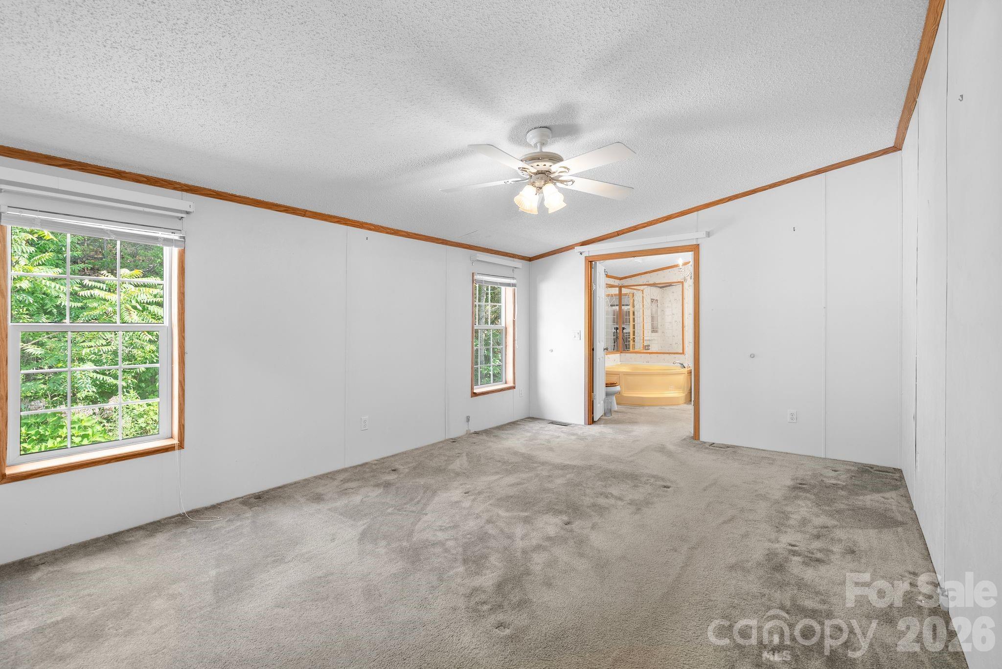 133 Spivey Mountain Road Asheville, NC 28806 - Photo 26 of 40 a view of an empty room with a window