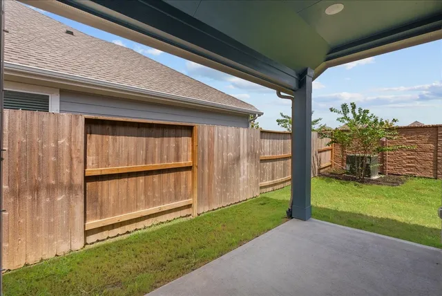 a view of backyard with cabin