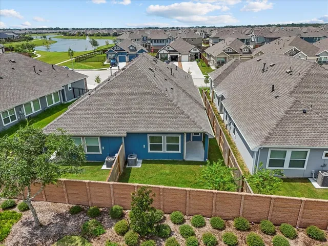 an aerial view of a house with a garden