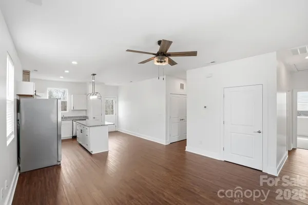 a view of a living room with wooden floor