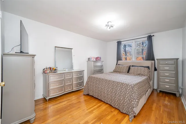 a bedroom with a bed and dresser