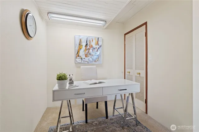 a view of a workspace with furniture