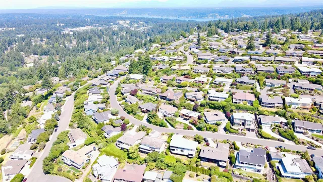 an aerial view of a houses with outdoor space and street view