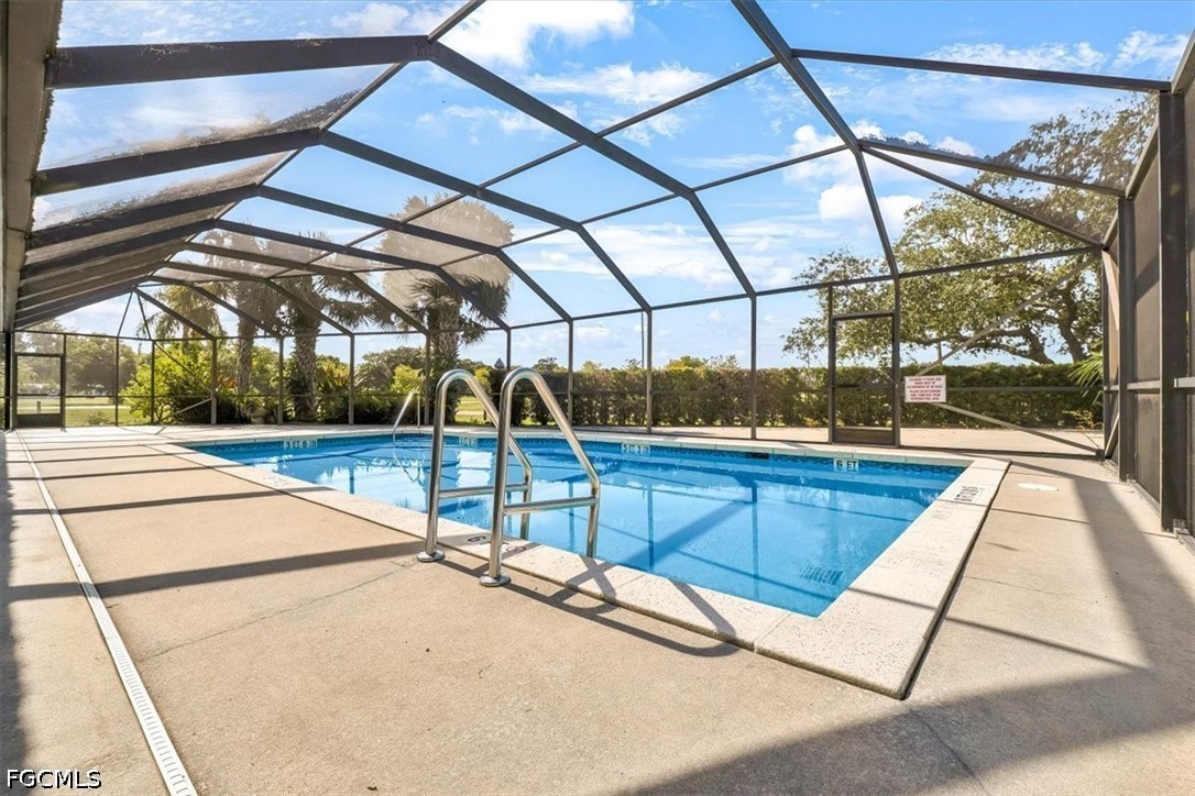 707 Hoover Dike Road, Unit 904 Clewiston, FL 33440 - Photo 6 of 41 a view of a balcony with a floor to ceiling windows and a table
