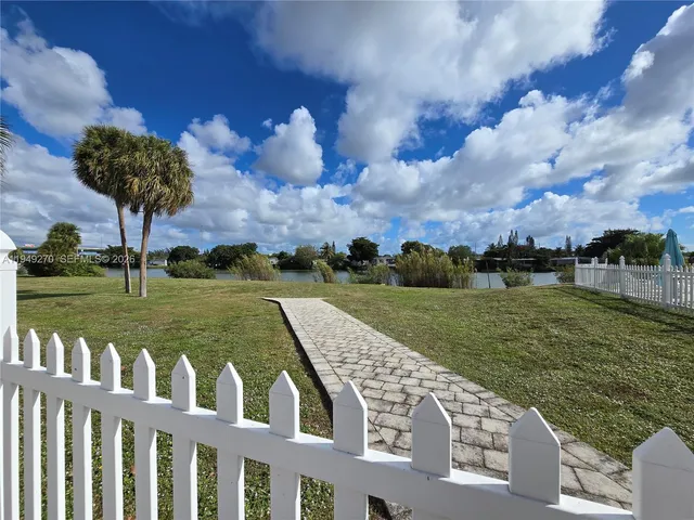 a view of a lake with a big yard