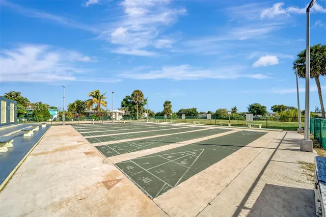 a view of swimming pool with outdoor seating and plants