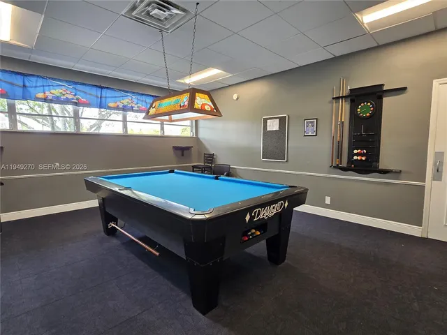 a view of storage and utility room with racks on the wall