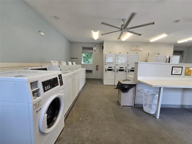 a view of a hallway with furniture