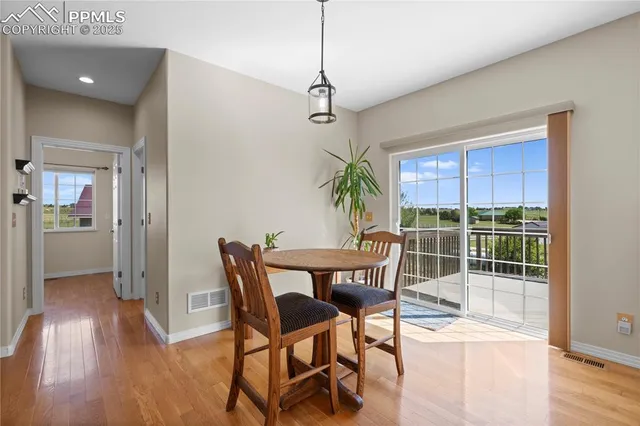 a dining room with furniture and window
