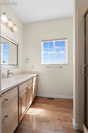 a bathroom with a sink and a window