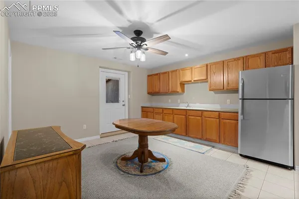 a kitchen with a refrigerator and a sink