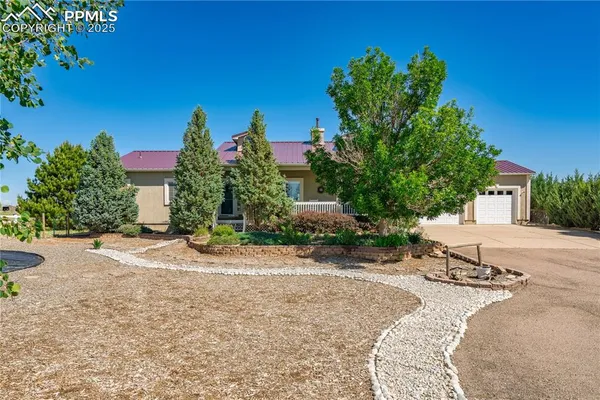a view of a backyard of a house