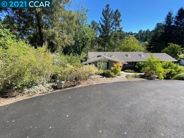 41 Muth Drive Orinda, CA 94563 - Photo 1 of 1 a view of a street with a bench under an umbrella