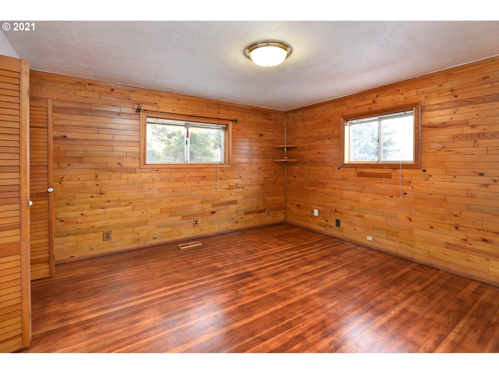 235 North 24th Street Springfield, OR 97477 - Photo 13 of 24 a view of an empty room and wooden floor