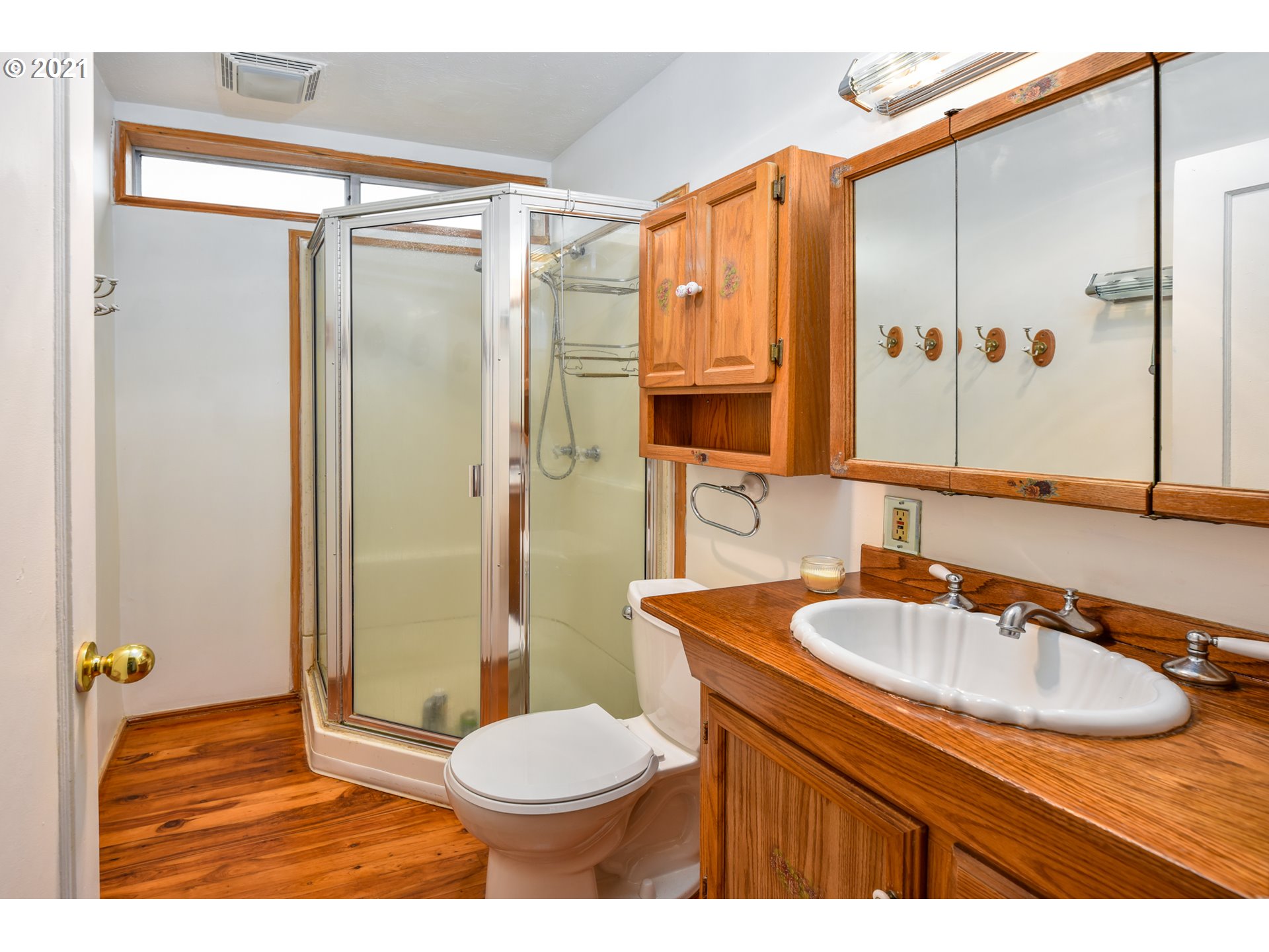 235 North 24th Street Springfield, OR 97477 - Photo 16 of 24 a bathroom with a sink a toilet and shower
