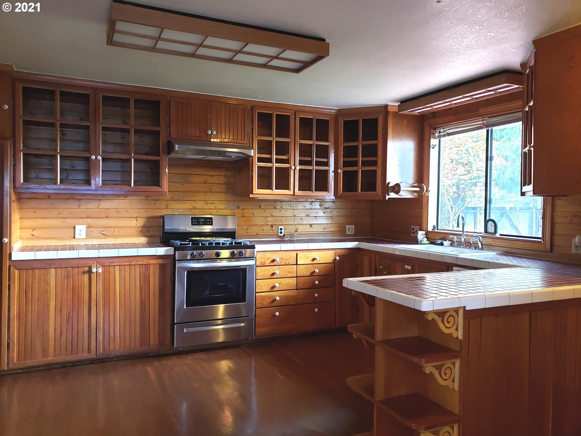 235 North 24th Street Springfield, OR 97477 - Photo 3 of 24 a kitchen with stainless steel appliances granite countertop a stove and a sink