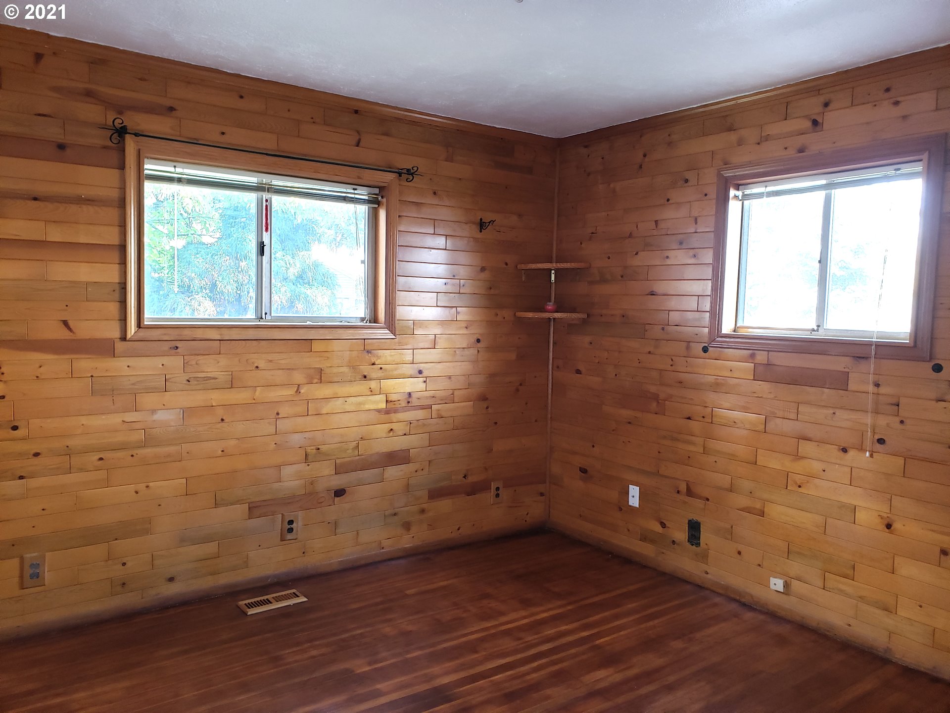235 North 24th Street Springfield, OR 97477 - Photo 6 of 24 a view of a small space with wooden floor and a window