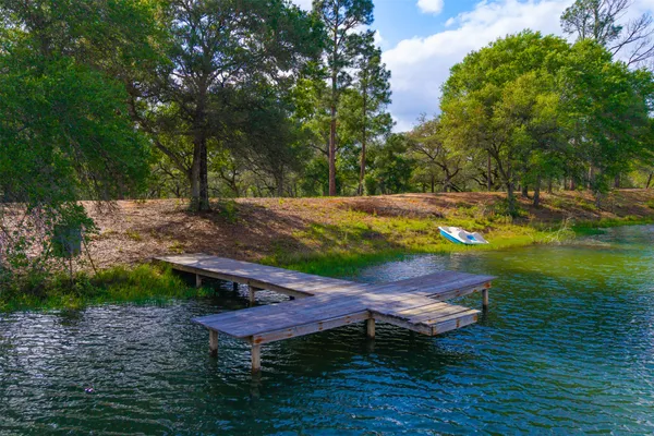 a view of a swimming pool with a yard