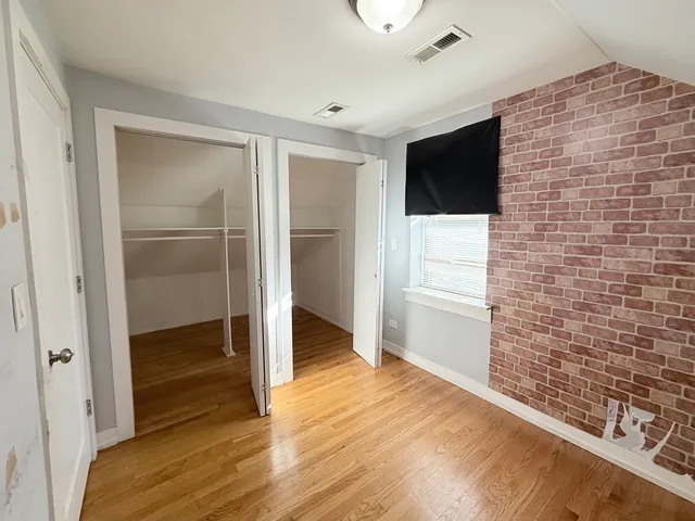 a view of a livingroom with wooden floor