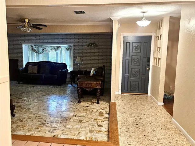 a living room with furniture windows and a fireplace