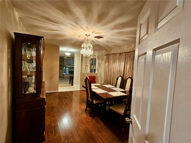 a room with wooden floor and furniture