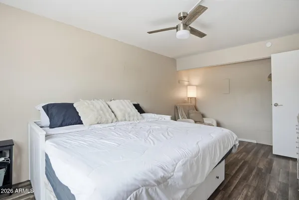 a view of a workspace with wooden floor