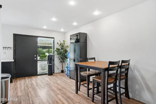 a view of a dining room with furniture and a window