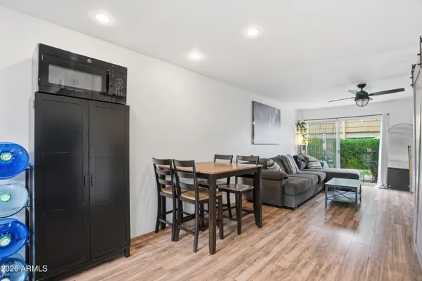 a view of a livingroom with furniture window and wooden floor