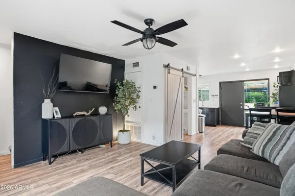 a living room with furniture and a flat screen tv