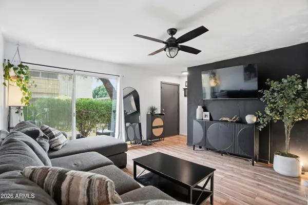 a living room with furniture and a large window