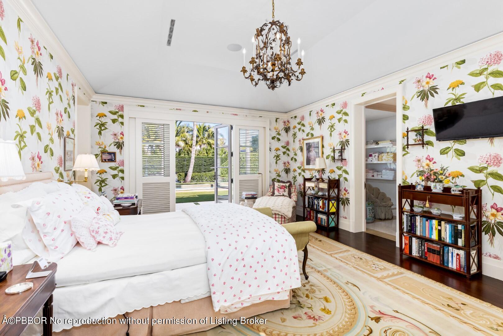 710 South County Road Palm Beach, FL 33480 - Photo 41 of 69 a bedroom with a large bed and a flat tv screen