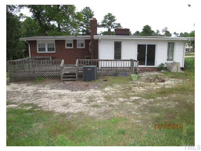 3912 Donna Road Raleigh, NC 27604 - Photo 11 of 13 a backyard of a house with yard and barbeque oven