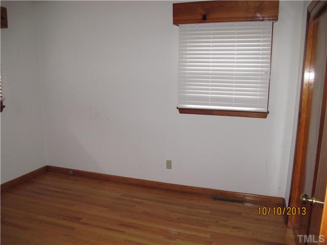 3912 Donna Road Raleigh, NC 27604 - Photo 4 of 13 a view of a small space with wooden floor and a window