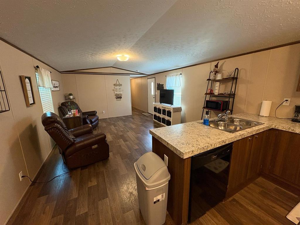 11093 Alta Vista Road Fort Worth, TX 76244 - Photo 9 of 10 a living room with furniture and a table