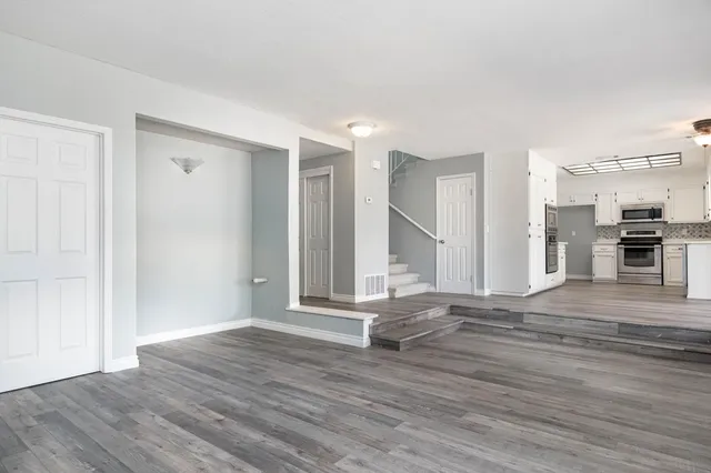 a view of a livingroom with wooden floor